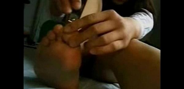  Fetishism - Cute girl cutting the nails on the bet